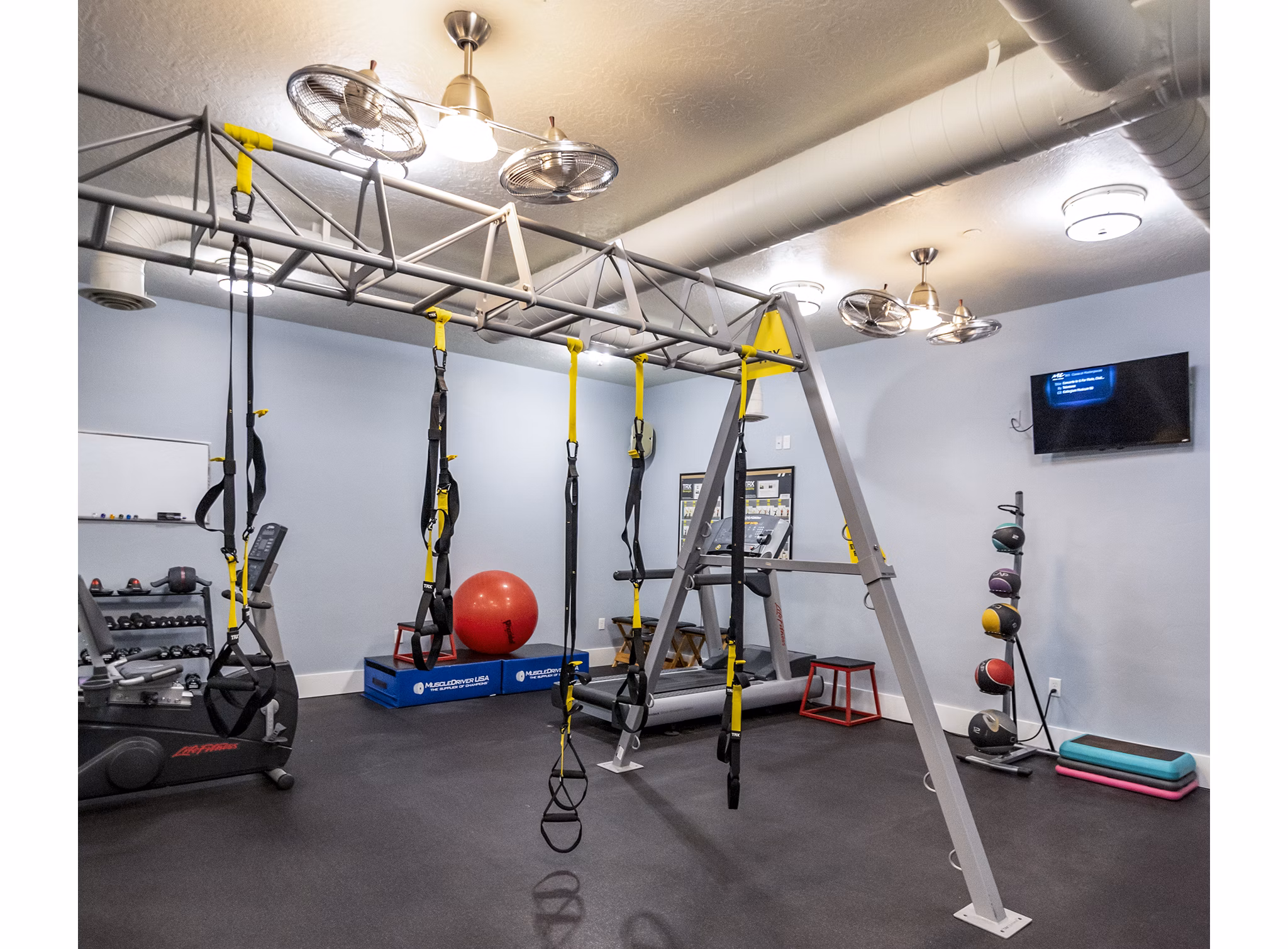 Modern fitness center featuring state-of-the-art equipment at Cottages on 7th, a 55+ community apartments