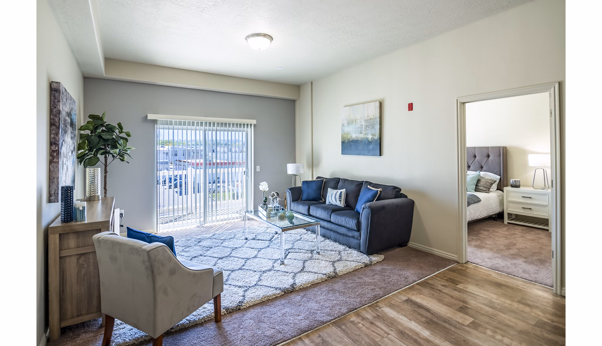 Cozy living room with plush seating and natural light in Cottages on 7th, a 55+ community apartments