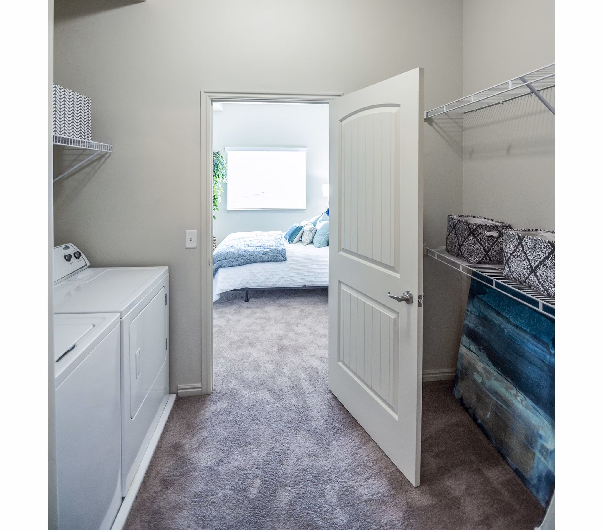 Laundry room with modern appliances at Cottages on 7th, a 55+ community