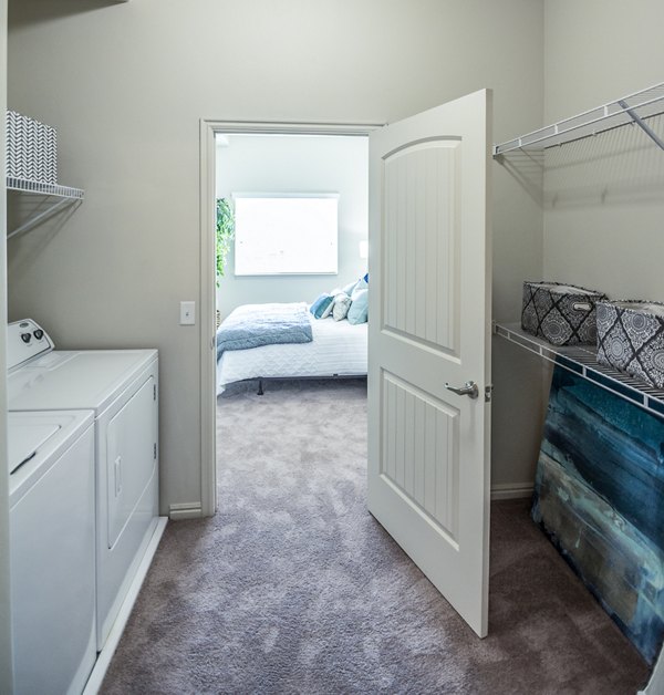 Laundry room with modern appliances at Cottages on 7th, a 55+ community