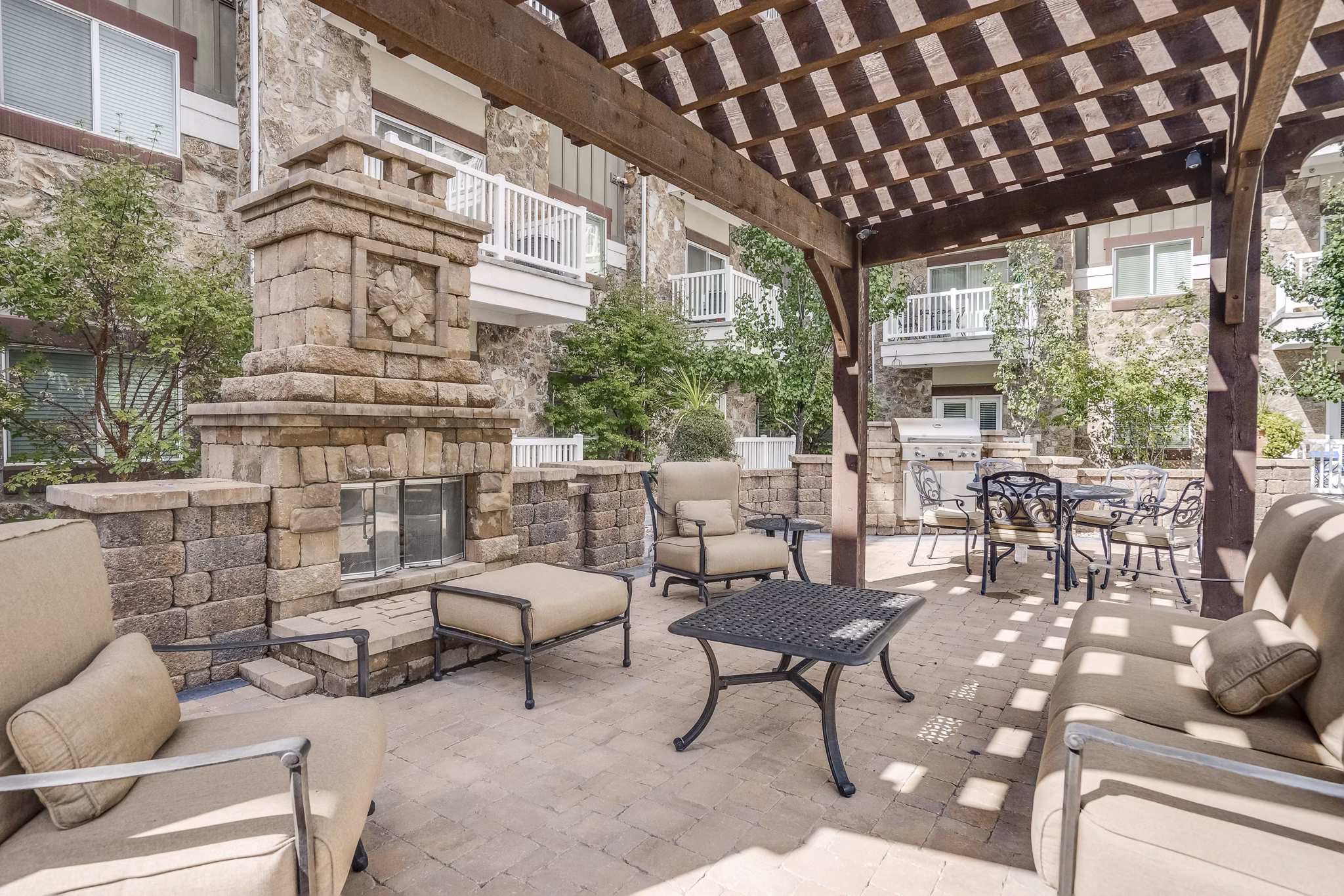 Outdoor recreational area at Cottages on 7th, a 55+ community featuring gardens and walking paths