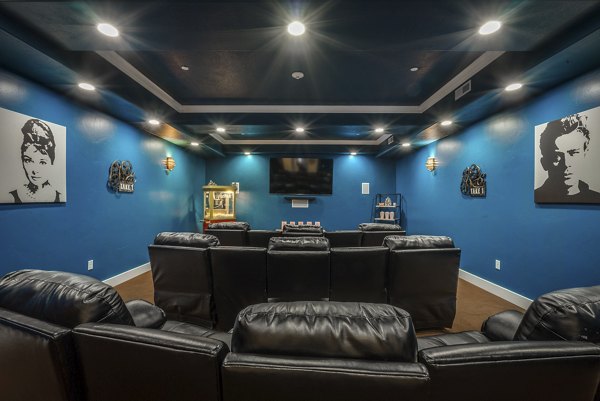 Movie room featuring plush seating at Cottages on 7th, a 55+ community ideal for relaxation and entertainment