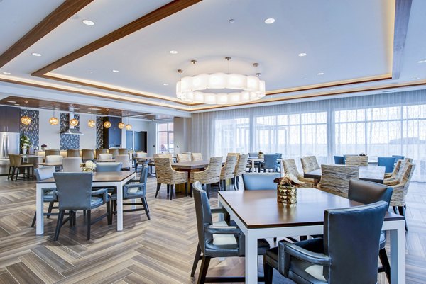 Clubhouse lobby featuring modern seating and communal workspaces at Overture Yorktown Apartments