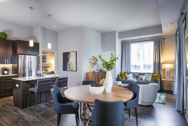 Dining room featuring elegant furnishings and hardwood floors at Overture Yorktown Apartments in Lombard, IL