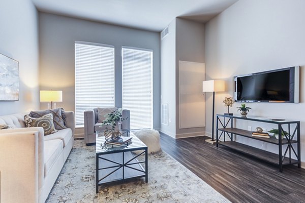 Spacious living room with modern furnishings at Overture Yorktown Apartments