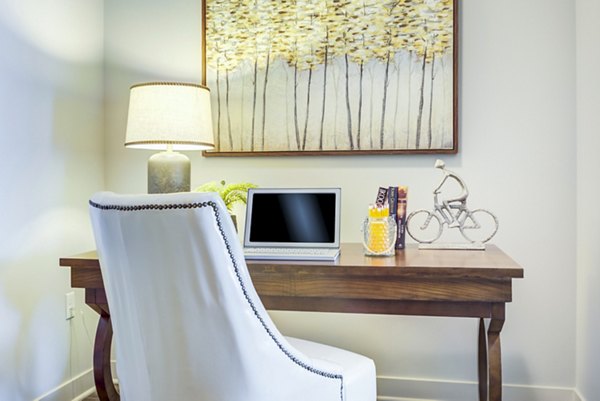 Modern home office and living room with sleek furnishings at Overture Yorktown Apartments, offering stylish luxury apartment living in a prestigious community