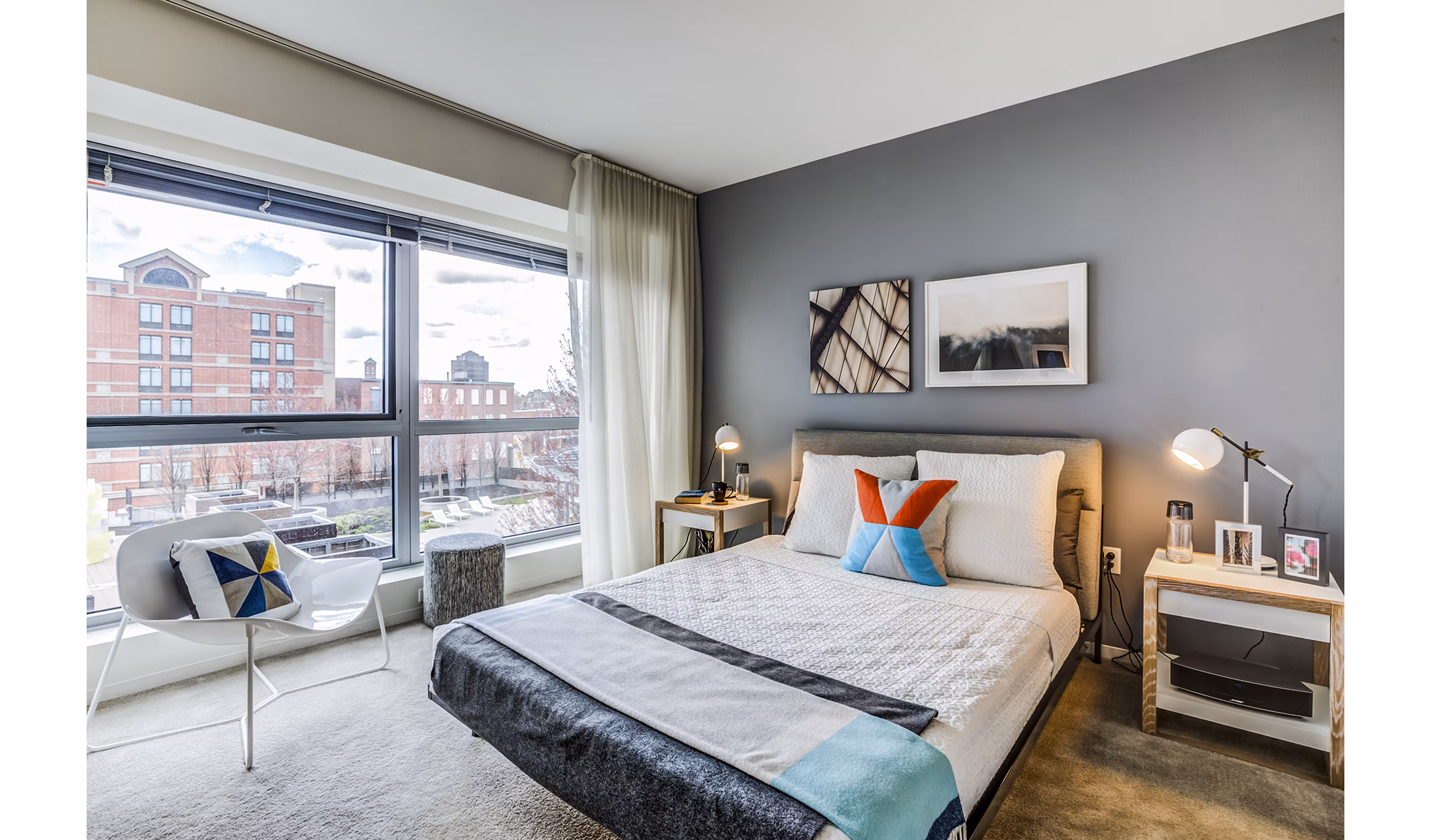 Modern bedroom with sleek furnishings at Zinc Apartments, featuring a serene design for comfortable living in a luxury community