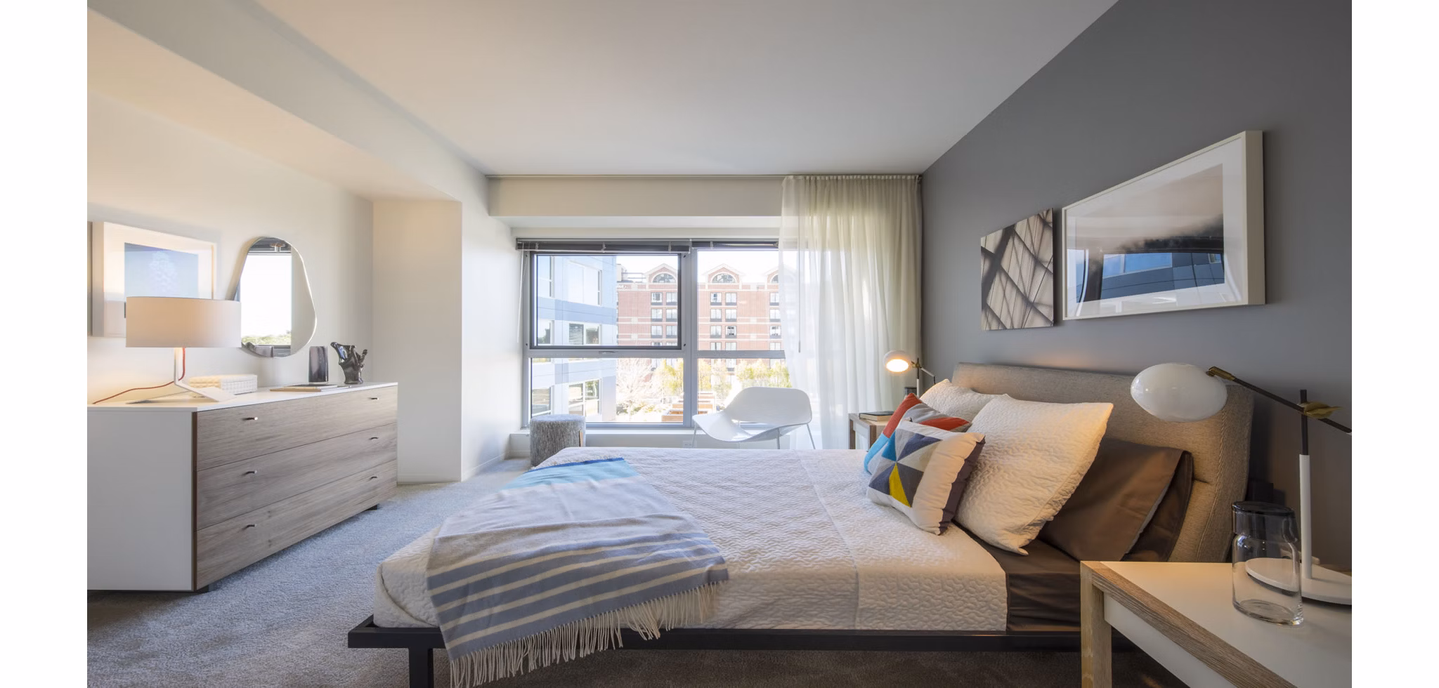 Cozy bedroom at Zinc Apartments featuring a plush bed and modern decor