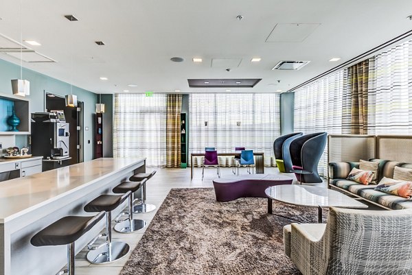 Luxurious clubhouse featuring modern design at Zinc Apartments, perfect for socializing and relaxation