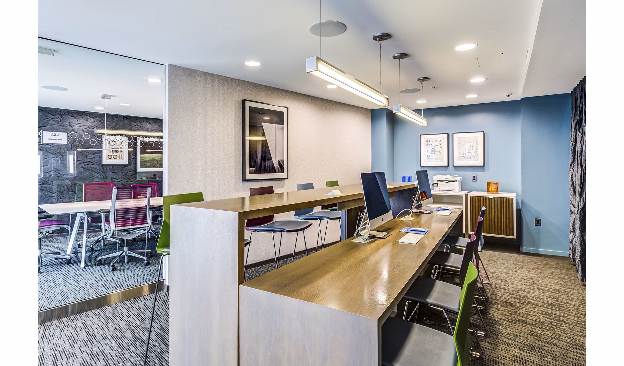 Modern business center with sleek workstations at Zinc Apartments