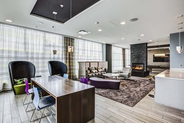 Clubhouse lobby with modern decor and seating at Zinc Apartments, a luxury community by Greystar