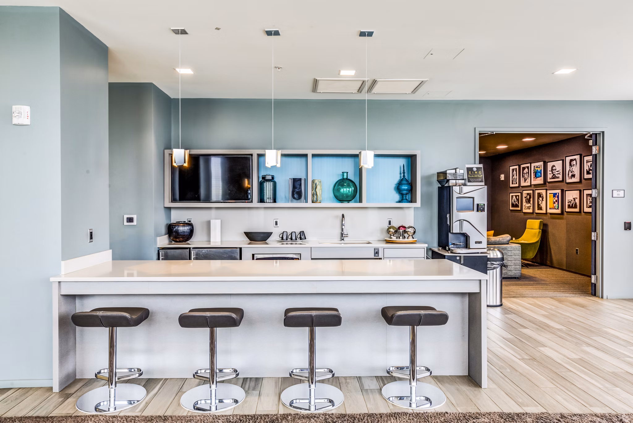 Chic clubhouse interior with modern decor at Zinc Apartments, ideal for social events and gatherings, enhancing luxury living experience