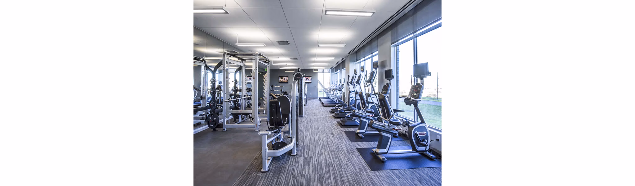Modern fitness center with state-of-the-art equipment at Zinc Apartments