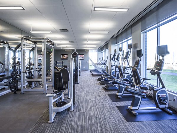Modern fitness center with state-of-the-art equipment at Zinc Apartments