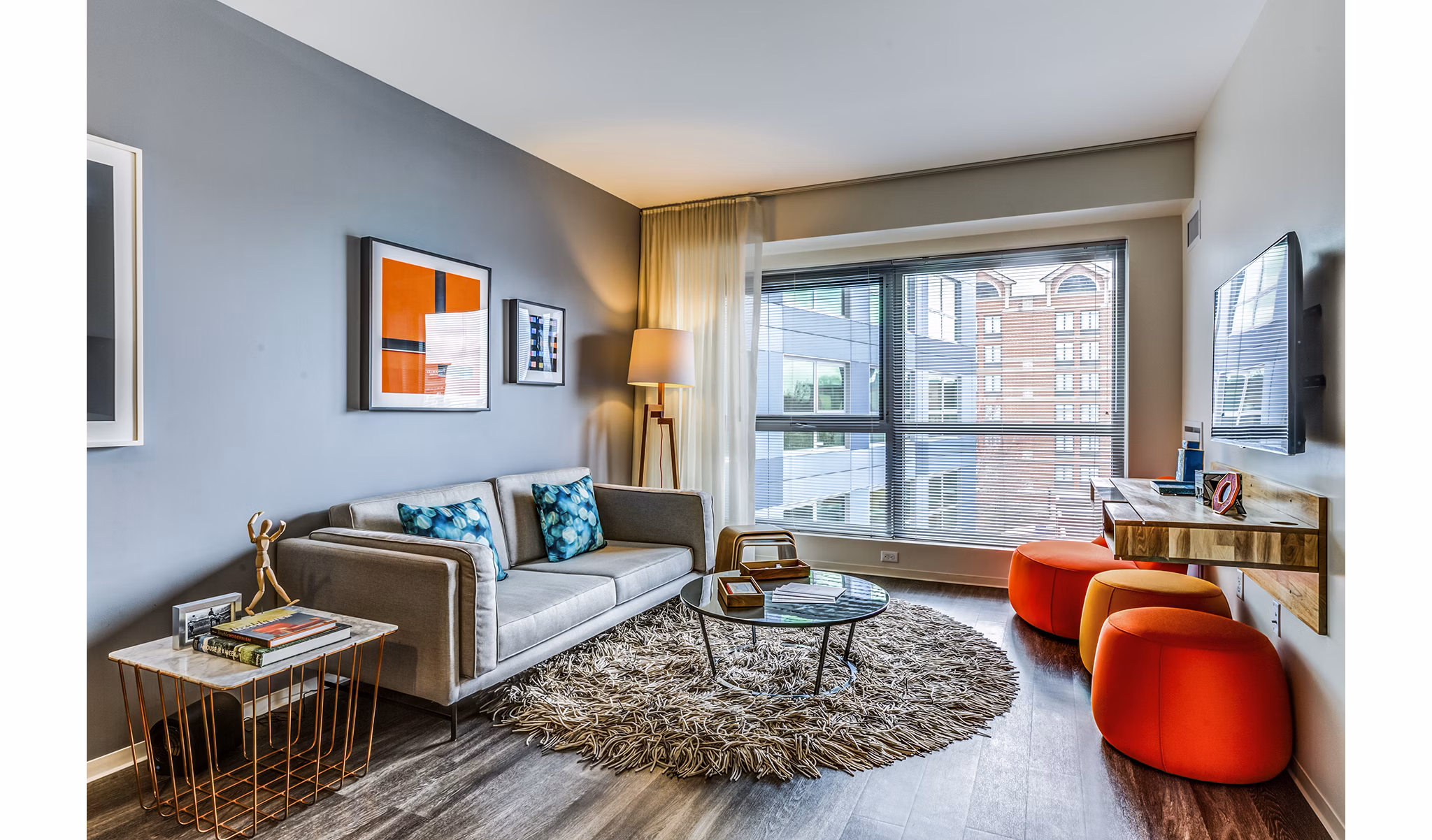 Contemporary living room with sleek furnishings in Zinc Apartments, offering luxurious urban living