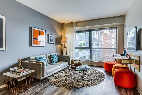 Contemporary living room with sleek furnishings in Zinc Apartments, offering luxurious urban living