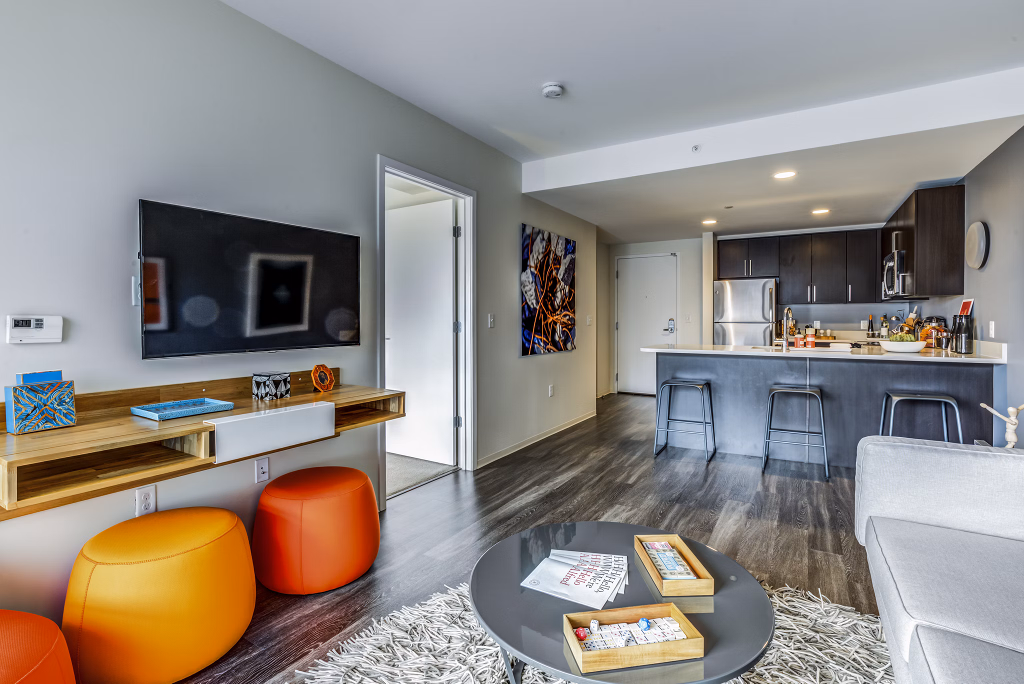 Contemporary living room with modern furnishings at Zinc Apartments, a Greystar luxury property