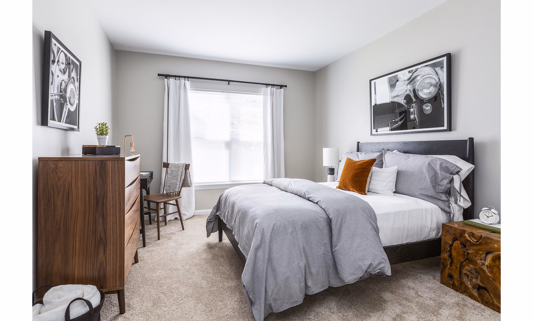 Spacious bedroom with large windows and modern decor in Pembroke Woods Apartments, offering a serene living experience
