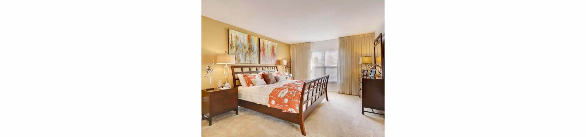 Cozy bedroom with natural light at Pembroke Woods Apartments luxury housing