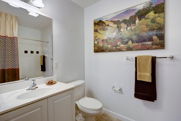 Bathroom featuring modern fixtures and elegant tilework at Pembroke Woods Apartments