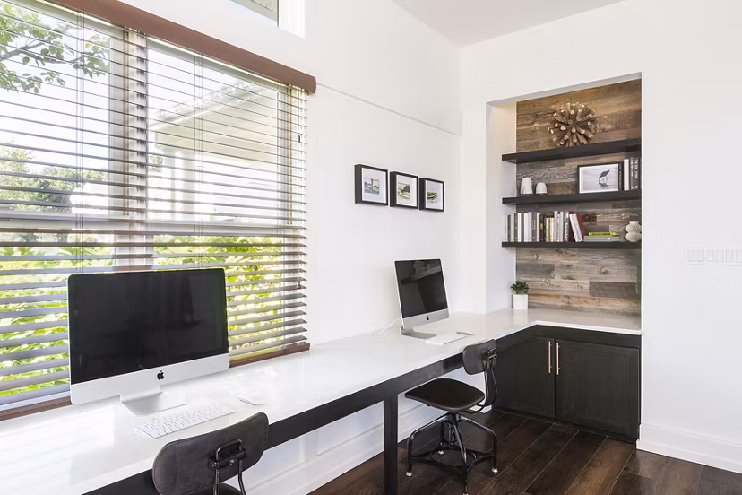Business center equipped with modern workstations and computers at Pembroke Woods Apartments, ideal for remote work and meetings