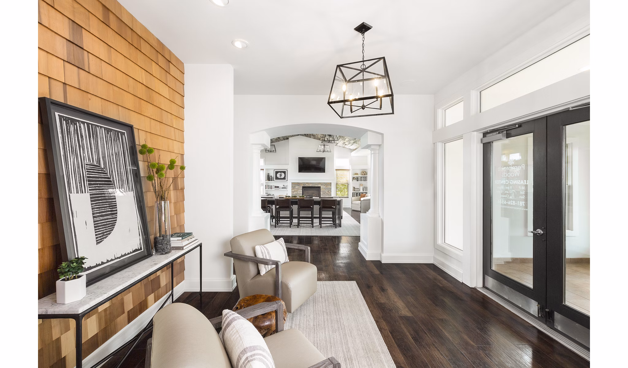Clubhouse with modern interior design at Pembroke Woods Apartments, featuring comfortable seating and entertainment options