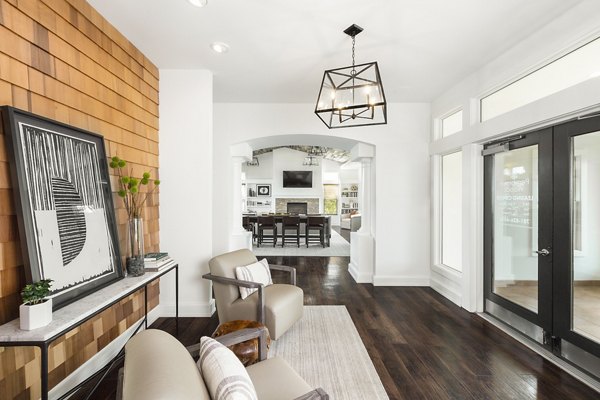 Clubhouse with modern interior design at Pembroke Woods Apartments, featuring comfortable seating and entertainment options