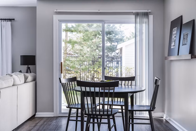 Dining area with elegant furnishings and natural light at Pembroke Woods Apartments