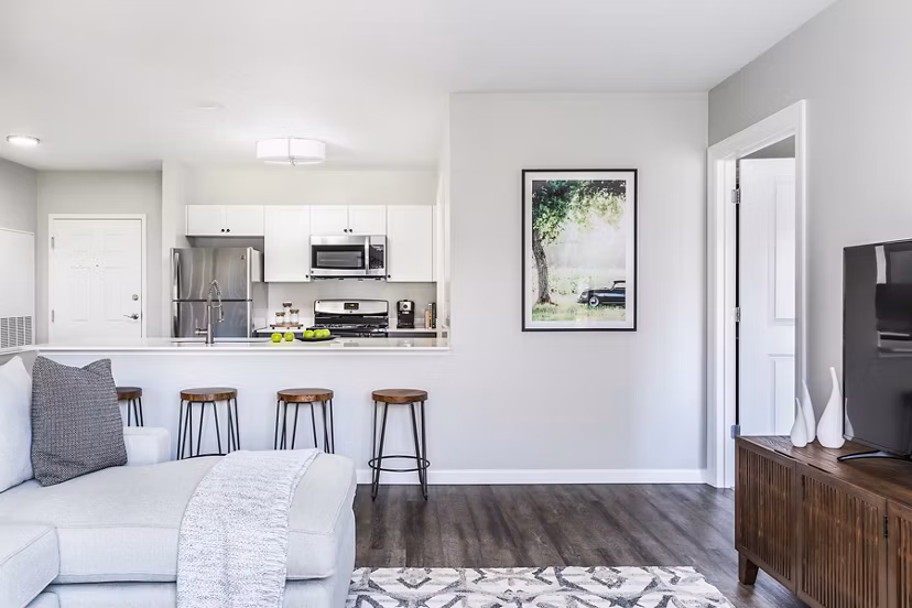 Dining room with modern furnishings in Pembroke Woods Apartments, featuring a sleek design and ample natural light for a luxurious living experience