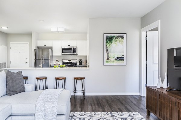 Dining room with modern furnishings in Pembroke Woods Apartments, featuring a sleek design and ample natural light for a luxurious living experience