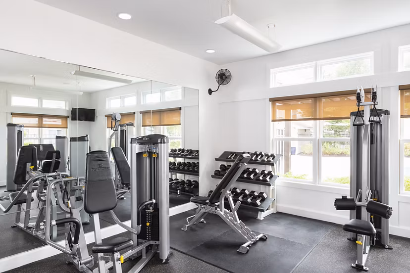 Modern fitness center with state-of-the-art equipment at Pembroke Woods Apartments, promoting healthy living and active lifestyles