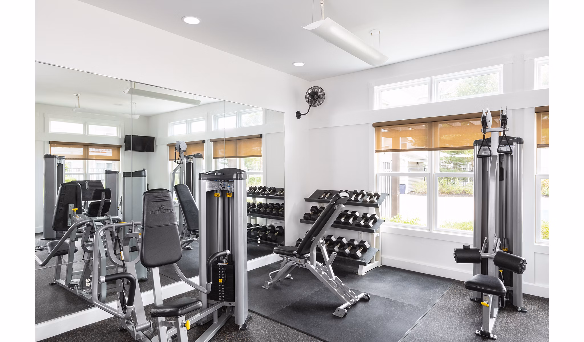 Modern fitness center with state-of-the-art equipment at Pembroke Woods Apartments, promoting healthy living and active lifestyles