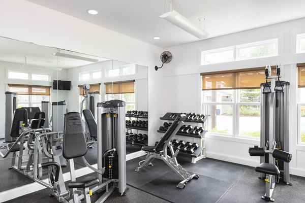Modern fitness center with state-of-the-art equipment at Pembroke Woods Apartments, promoting healthy living and active lifestyles