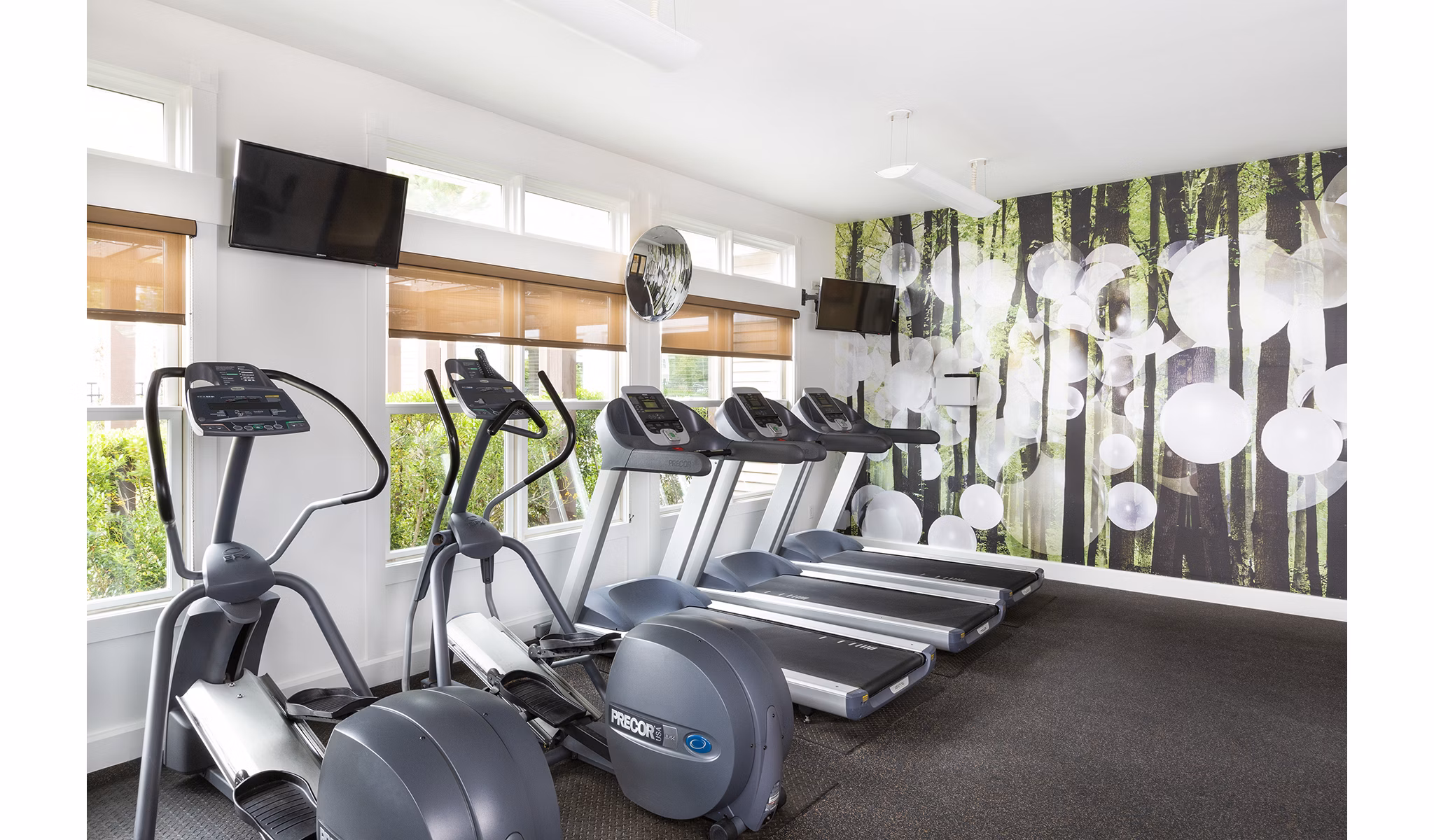 State-of-the-art fitness center featuring modern equipment at Pembroke Woods Apartments