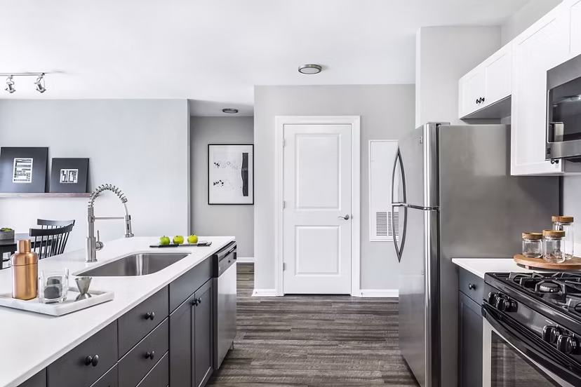Modern kitchen featuring stainless steel appliances in Pembroke Woods Apartments