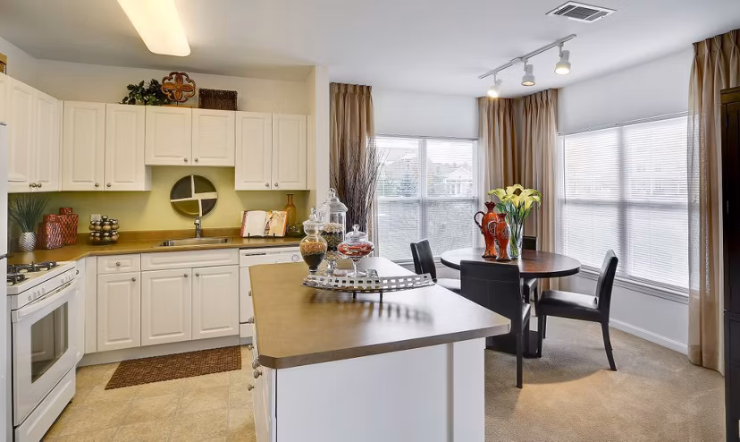 Kitchen featuring stainless steel appliances and granite countertops at Pembroke Woods Apartments