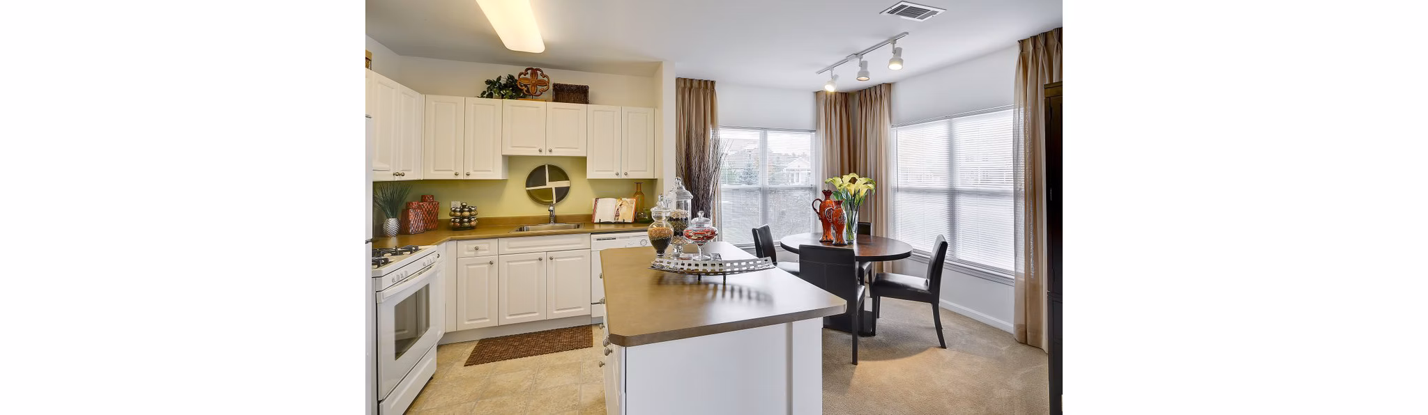 Kitchen featuring stainless steel appliances and granite countertops at Pembroke Woods Apartments