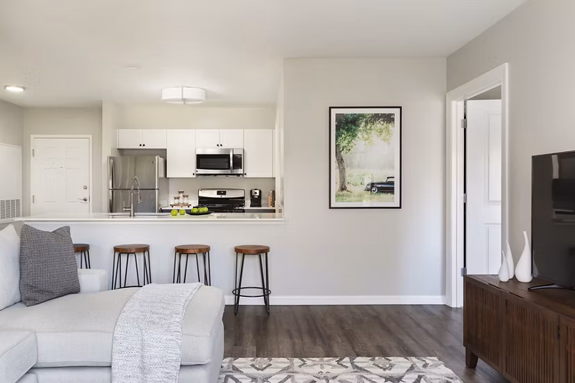 Spacious living room with contemporary furnishings in Pembroke Woods Apartments