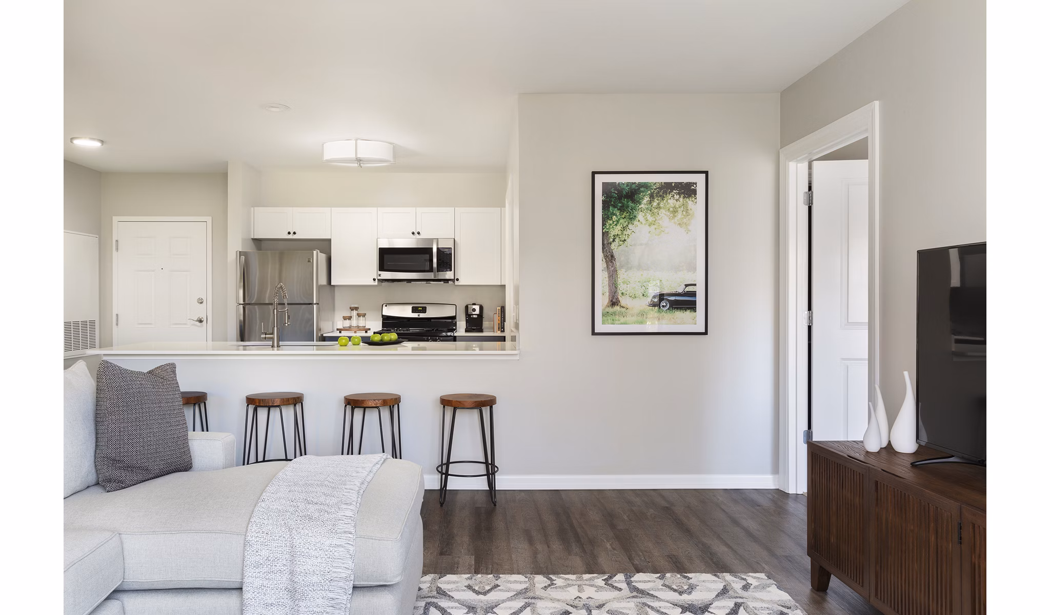 Spacious living room with contemporary furnishings in Pembroke Woods Apartments