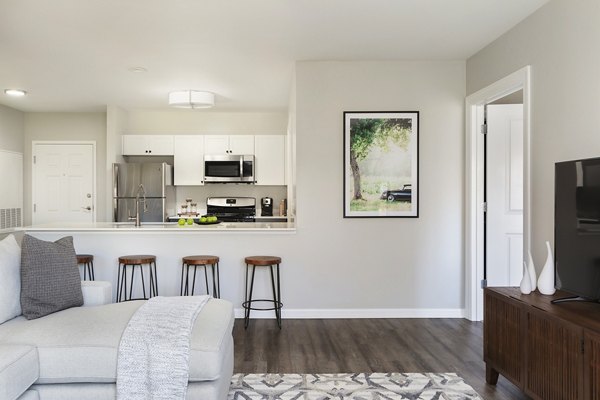 Spacious living room with contemporary furnishings in Pembroke Woods Apartments