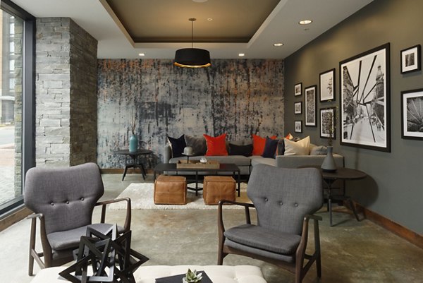 The Aspen Apartments: Elegant clubhouse with modern design and comfortable seating, perfect for social gatherings and relaxation