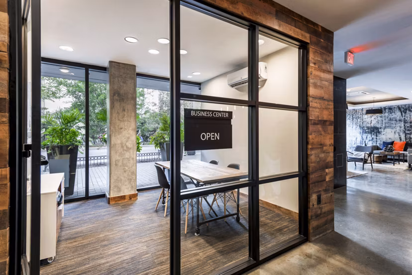 Modern business center with collaborative workspaces at The Aspen Apartments, designed for productivity and convenience