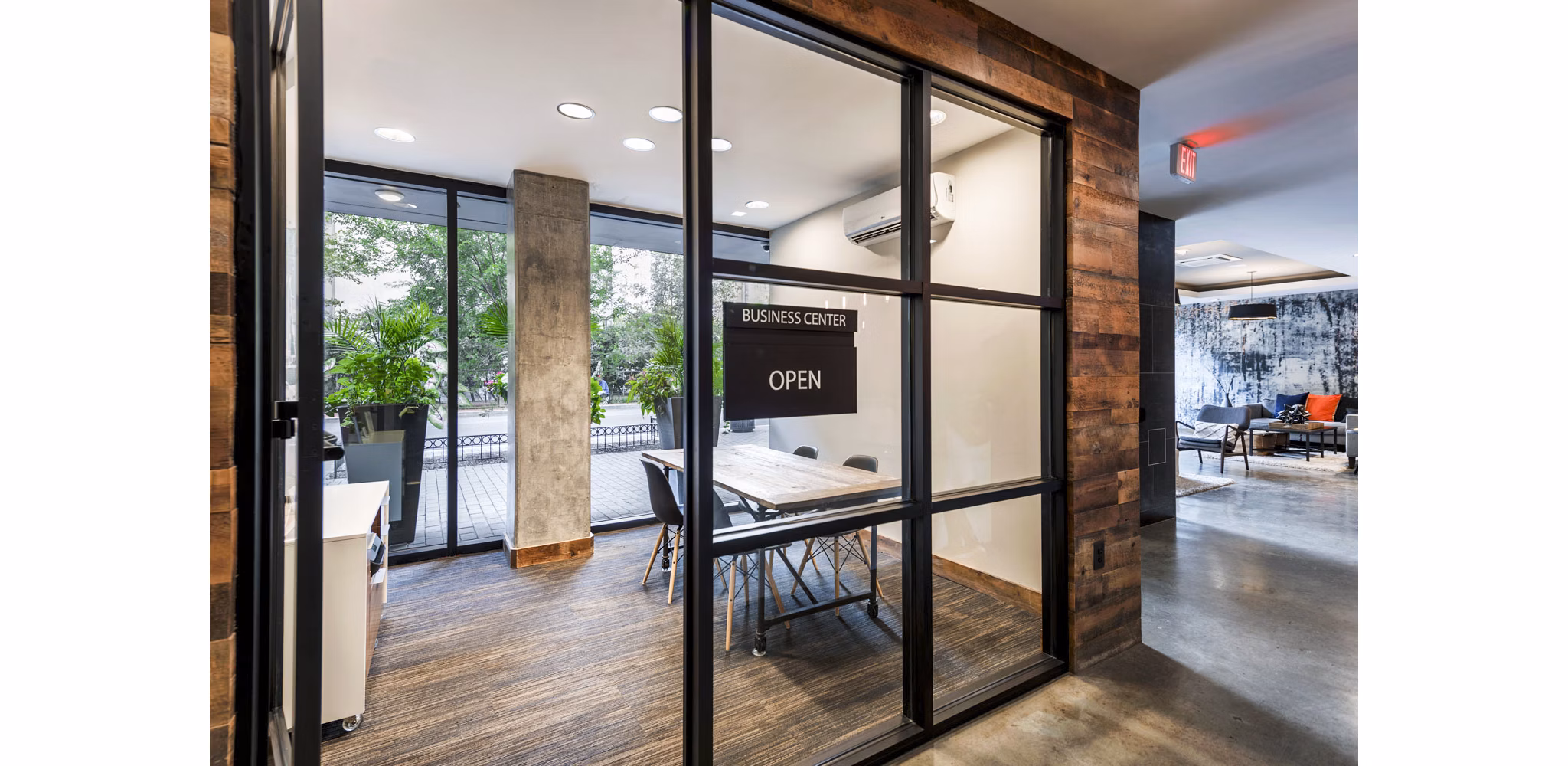 Modern business center with collaborative workspaces at The Aspen Apartments, designed for productivity and convenience