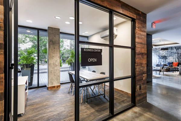 Modern business center with collaborative workspaces at The Aspen Apartments, designed for productivity and convenience