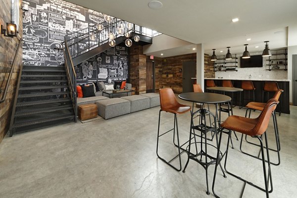 Modern clubhouse with stylish seating and fireplace at The Aspen Apartments