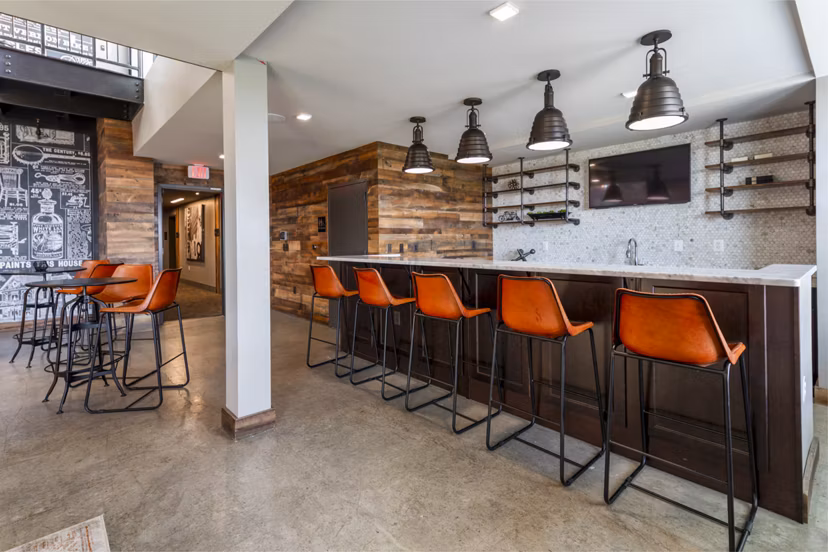 Clubhouse with contemporary design and comfortable seating at The Aspen Apartments, luxury living spaces in a vibrant community