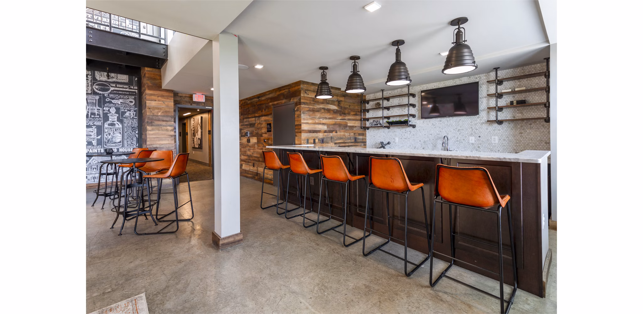 Clubhouse with contemporary design and comfortable seating at The Aspen Apartments, luxury living spaces in a vibrant community