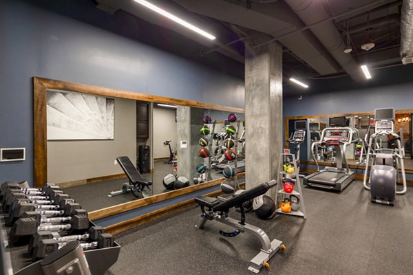 Aspen Apartments: Modern fitness center with state-of-the-art equipment in a luxury setting