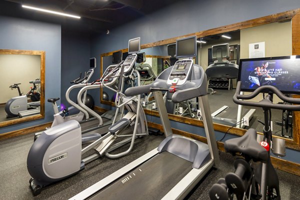 Fitness center with modern equipment at The Aspen Apartments