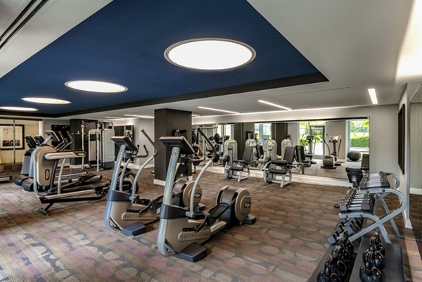 GS Nouvelle: Elegant fitness center equipped with modern gym facilities, featuring cardio machines and weights